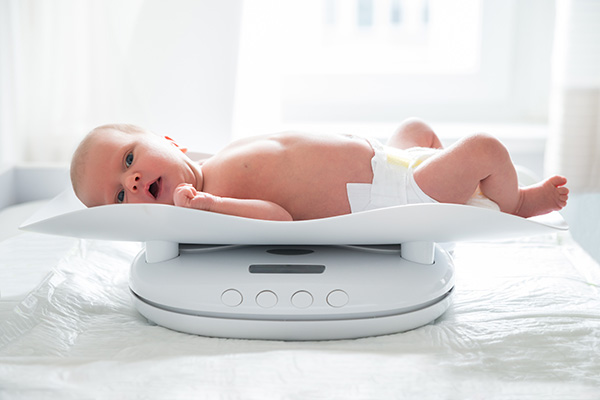 image of baby being weighed